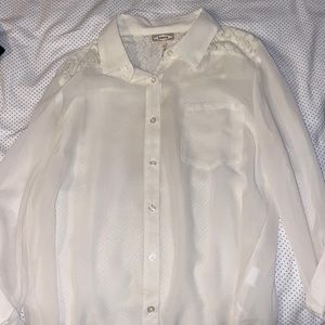 white/sheer button down long sleeve with flower detailing on the upper shoulder